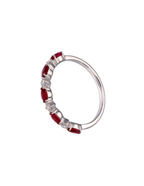 ANILLO RUBí OVALADO Y DIAMANTES REDONDOS